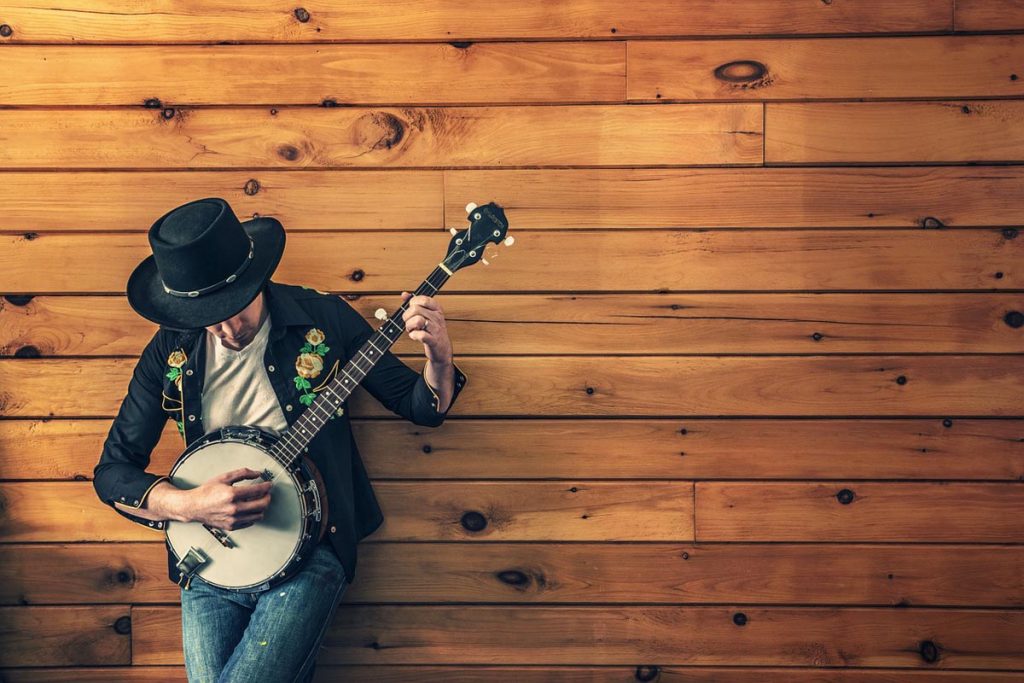 Gitarre Männermode Hut Jeanshose